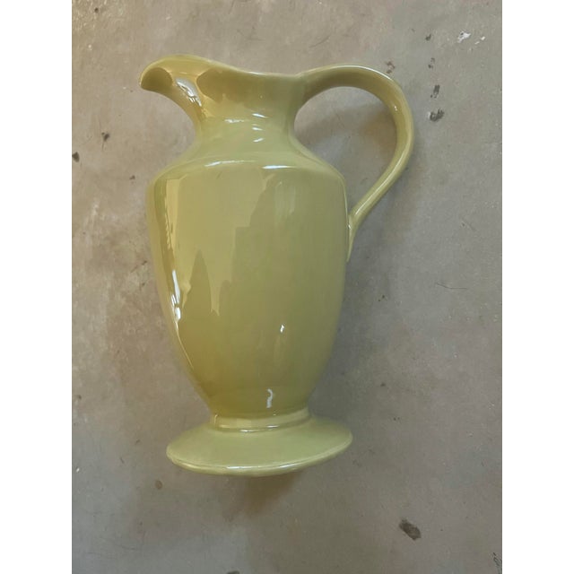 Tall ceramic Pitcher, vase or Creamer. In a soft green color. Part of the Great Room Collection Green Tea. Measures 7.5”...