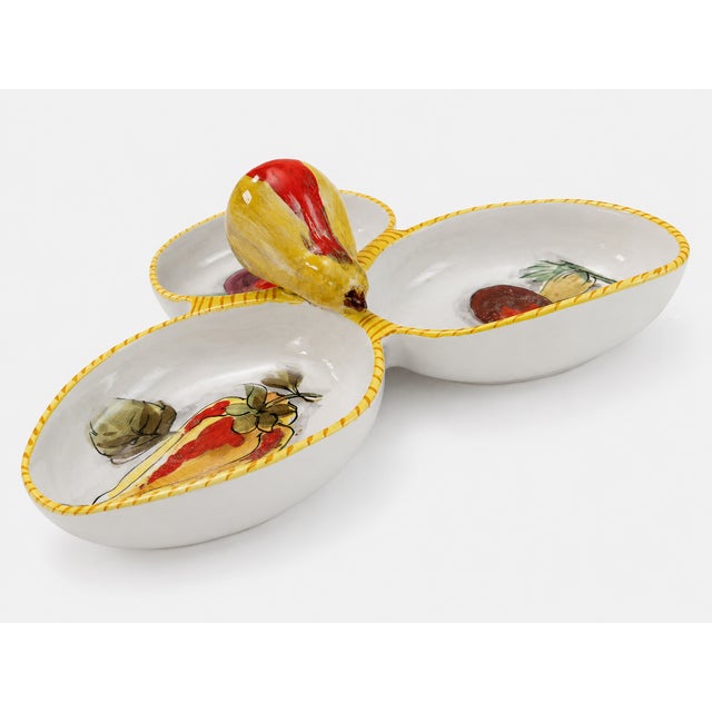Hand-painted Italian ceramic serving dish featuring three connected bowls, a bright yellow rim, painted fruit and leaf...