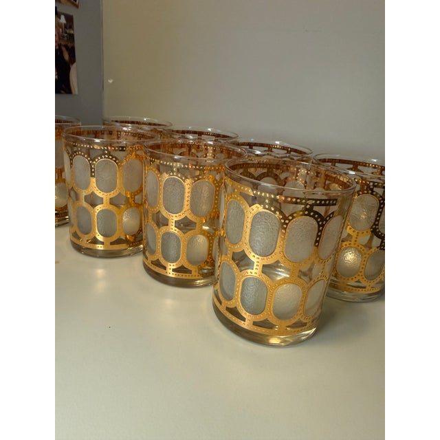A striking set of eight signed mid-century cocktail glasses by Cera, featuring the iconic “Golden Windows” pattern in...