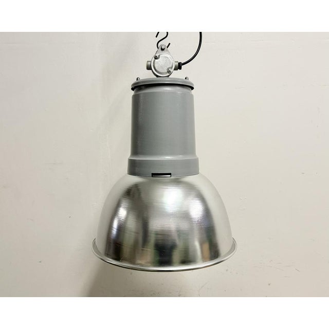 This pendant light was made by Fael Luce in Italy during the 1970s. The piece is comprised of an aluminium lampshade and...