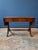 Attractive two-drawer sofa table with drop leaves featuring a double stretcher base, reeded outswept legs, and brass paw...