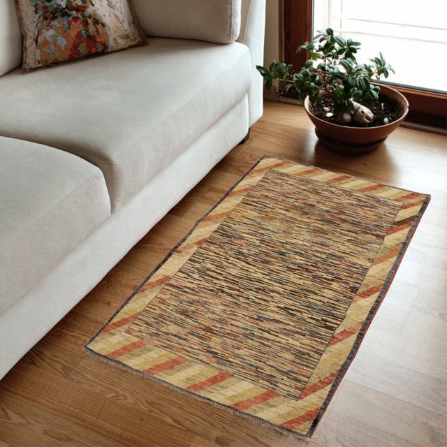 Transform your home's interior with a stunning hand-knotted Gabbeh rug. These rugs are meticulously crafted with bold...