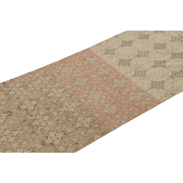 This vintage runner rug is a 3x9 Turkish distressed piece, made with hand-knotted wool circa mid-20th century. It is an...