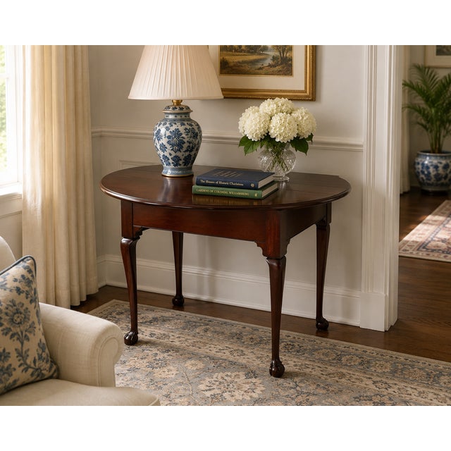 A finely crafted drop-leaf table by Kittinger, produced as part of their renowned Colonial Williamsburg collection....