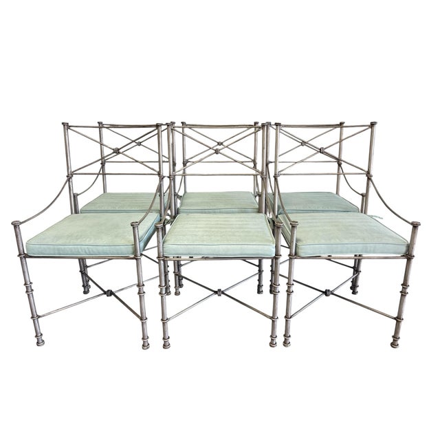 Striking set of six Giacometti-style dining chairs crafted in iron with a hand-finished silvered surface. These sculptural...