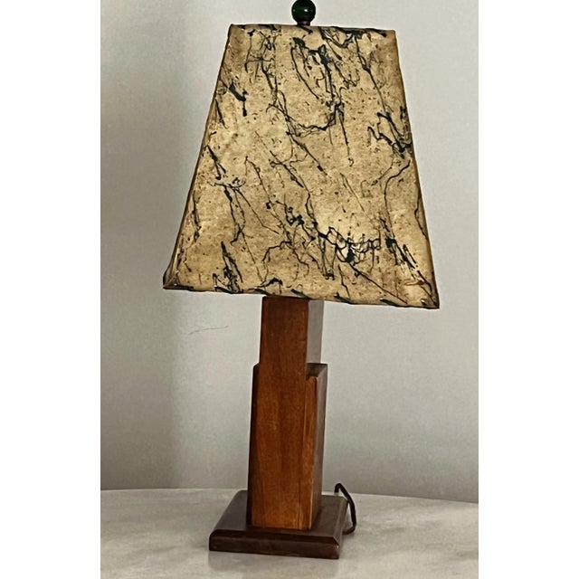 This Mid-century /Art Deco style lamp has a parchment (from sheep or goat skin) shade with green drizzle paint decoration...