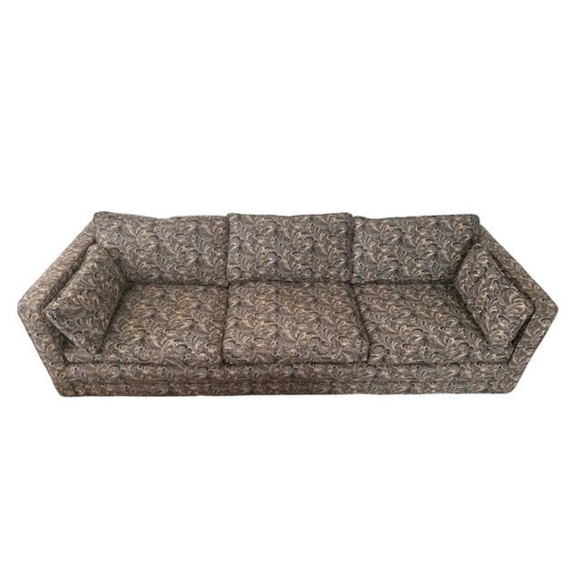 A striking Mid-Century Modern sofa featuring clean architectural lines, low profile silhouette, and deep seating comfort....