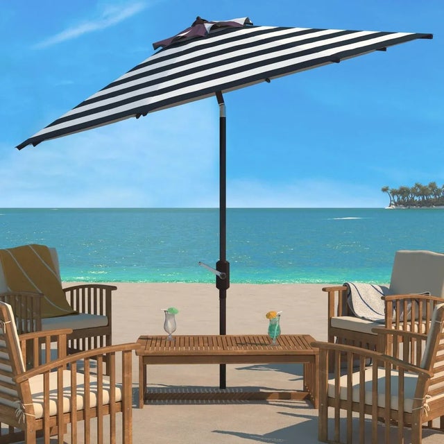 Inspired by the cosmopolitan Art Deco hotels in the heart of Miami Beach, this Iris Umbrella is absolutely fashion...