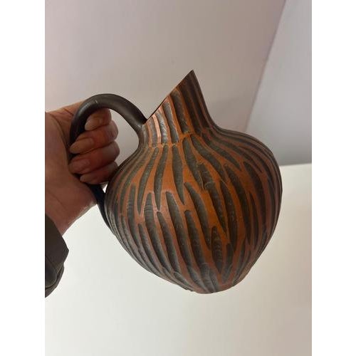 This mid-century vase from the Rhodos series is a distinctive piece of West German ceramics from the 1960s, crafted by the...