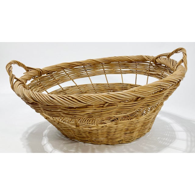Large vintage loose weave basket with woven handles. A wonderful size for blankets, towels, extra pillows, or even for use...