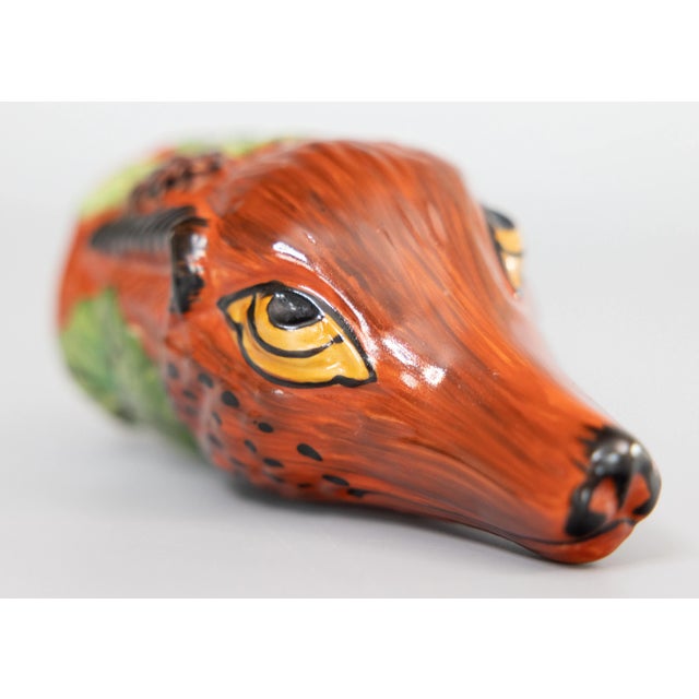 A fine 19th Century English Staffordshire fox hunting stirrup cup. This charming stirrup cup is in the form of a fox head...