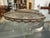 Pair of oval serving trays (or carafe/bottle coasters) in cut crystal, set in hand-chiseled 800/1000 sterling silver...