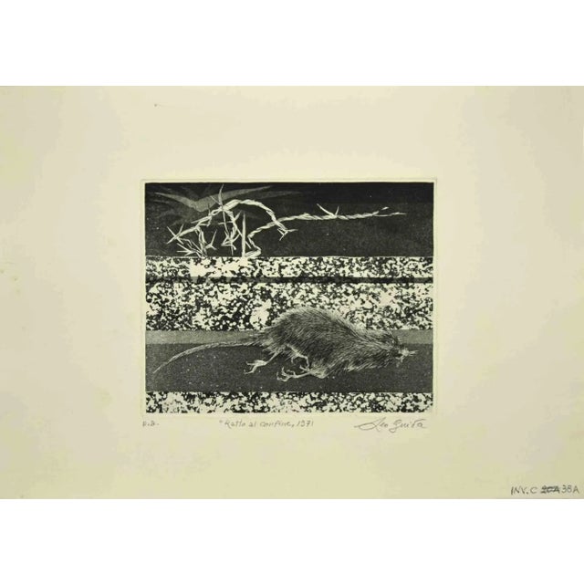 Rat at the Border is an original etching realized by Leo Guida in 1971. Good condition. Mounted on a white cardboard...