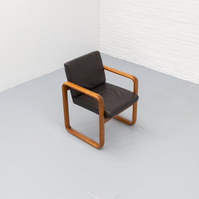Beautiful dark brown leather and solid ashwood armchair from the "Hombre" series by Burkhard Vogtherr for Rosenthal, made...