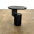 The Insert Side Table from Ferm Living showcases refined Scandinavian design through its interplay of contrasting forms—a...