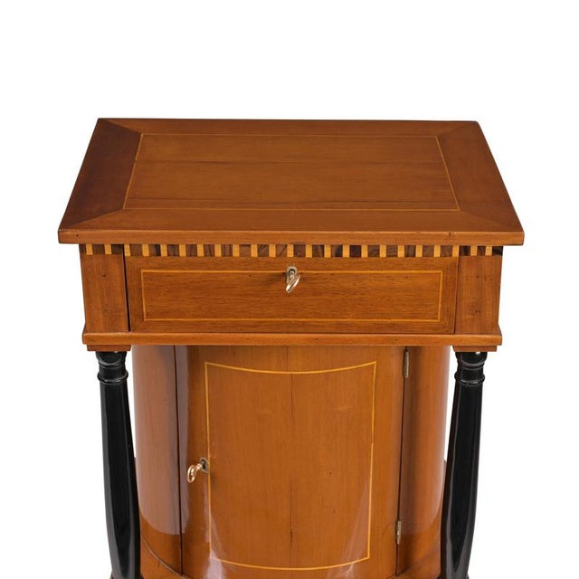 Small sideboard, France, circa 1800/1810; very light mahogany; maple thread inlay; ebonized solid columns; semicircular...
