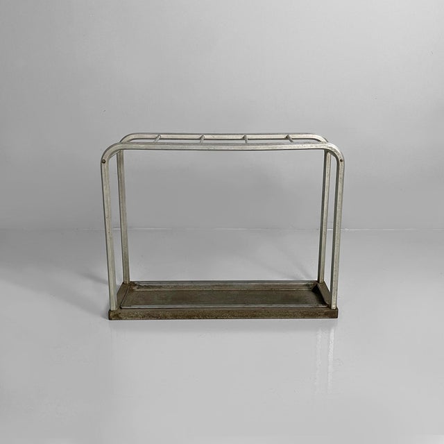 Italian mid-century modern umbrella stand in iron and aluminum, 1950s Umbrella stand with curved aluminum tubular...