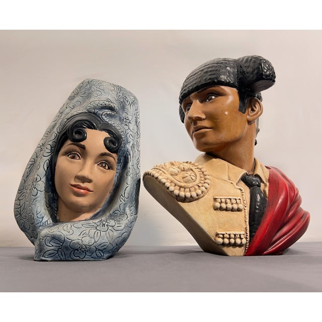 A striking vintage pair of hand-painted Marwal by Brower chalkware busts depicting a Spanish matador and mantilla-clad...