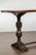 An Italian walnut console table from the early 19th century, with dentil molding, carved legs and cross stretcher. Created...