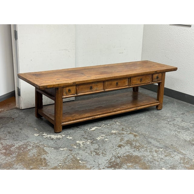 Design Plus Gallery presents an Antique Chinese Alter Table. This rustic wooden console table offers drawers that open...
