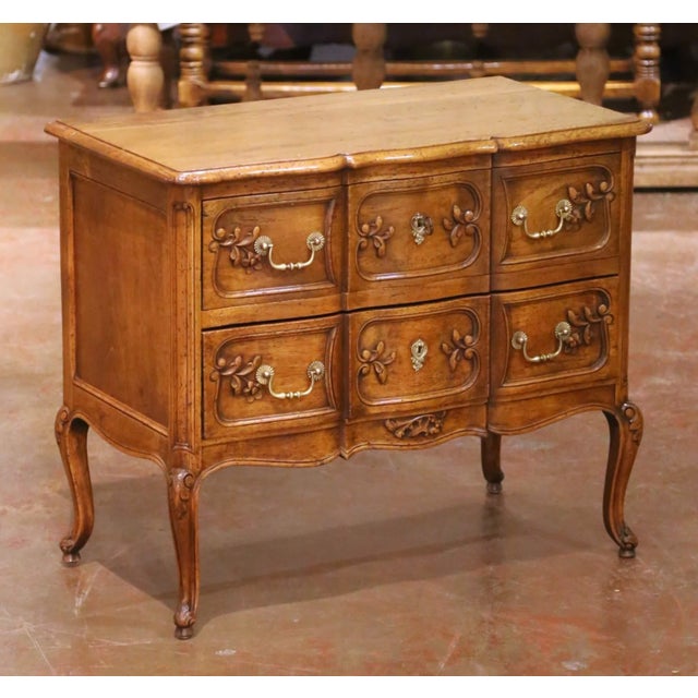 Circa 1920, this elegant antique walnut “sauteuse” chest was crafted in Provence and reflects the graceful lines...