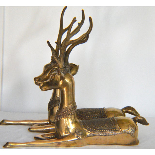 Beautiful Large Sarreid Style Brass Resting Deer Stag w/decorative ethnic ornamentation saddle cover and patches. It's...