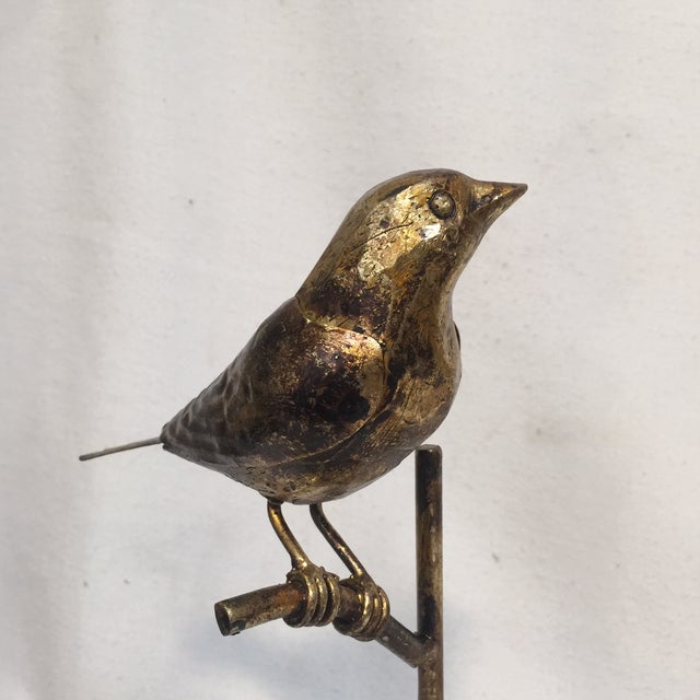 Metal bird sculptures -a Pair. Lotsa work goes into creating these happy Birds on a branch. Featuring antique Gold leaf...