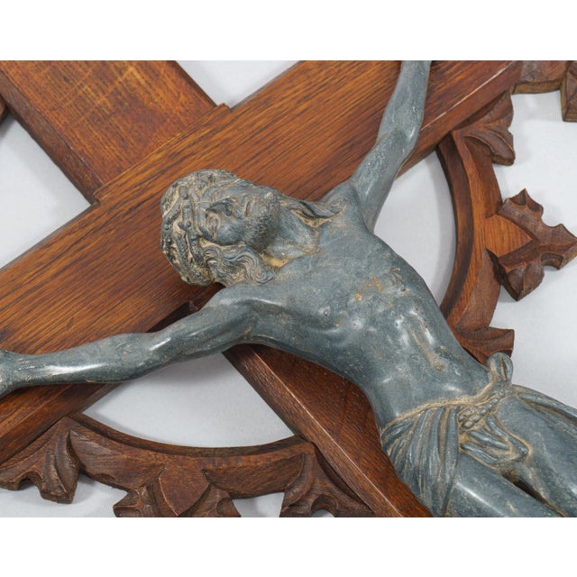 A very large and detailed wall-hanging crucifix of carved oak with neo-Gothic quatrefoil decoration and a beautifully...