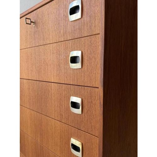This Swedish mid-century chest of drawers from the 1960s distinguishes itself through its clean lines, compact dimensions,...