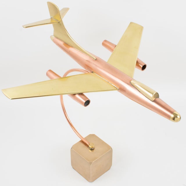 This is a stunning, large brass and copper airplane model made in France circa 1960. The piece features an impressive all-...