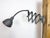 This vintage industrial adjustable gooseneck grey scissor wall light was produced by Elektroinstala Dečín in former...
