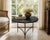 1970s Italian Portoro black marble cocktail or accent table with a sculptural patinated mixed-metal architectural tripod...