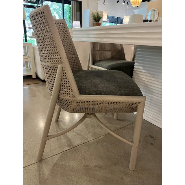 This gorgeous dining chair designed by Laura Kirar for McGuire ensures an elevated coastal vibe to your dining room. The...