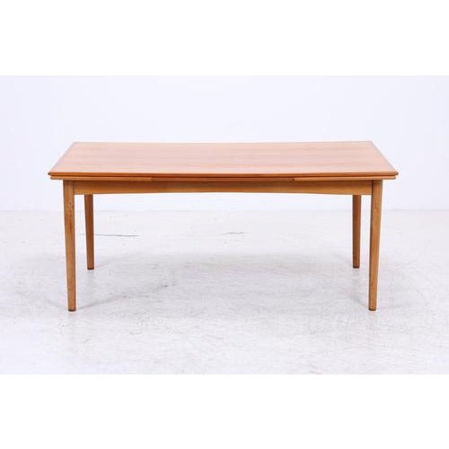 Vintage teak dining table with clean lines, rounded edges, and slender legs. The table can be extended on both sides,...