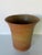Beautiful 1980s vintage studio pottery planter or vase featuring an organic form and warm earth-tone speckled glaze. The...