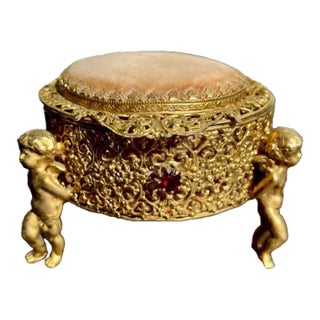 Three Footed Cherub Round StyleBuilt Style Vintage Design Jewelry Casket/ Box With Pink Plush on the Top and Inside & Burgundy Red Stones Decoration For Sale