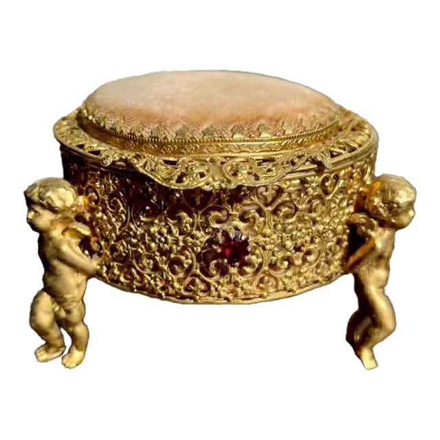Three Footed Cherub Round StyleBuilt Style Vintage Design Jewelry Casket/ Box With Pink Plush on the Top and Inside & Burgundy Red Stones Decoration For Sale