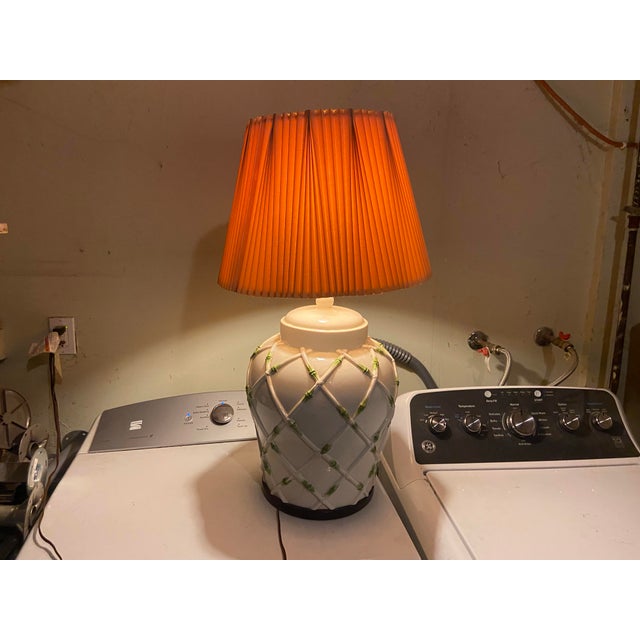 This Vintage MCM Hollywood Regency Faux Bamboo White Ceramic Table Lamp is a charming piece with a tropical pattern and...