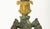 A pair of 19th century French gilt and patinated bronze candlesticks, each featuring a tapering columnar shaft in warm...