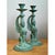 This captivating pair of vintage candleholders presents winged sphinx figures cast in bronze, each with a serene, softly...
