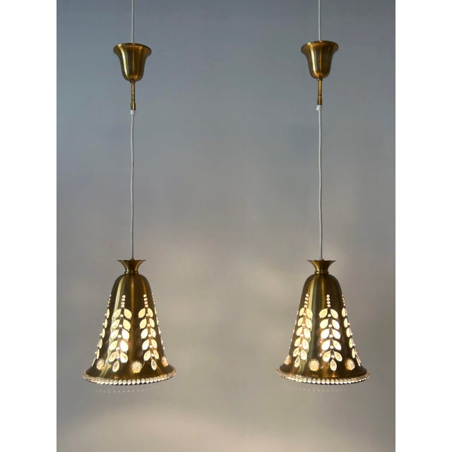 Set of two rare, lovely and highly decorative mid-century modern brass and crystal pendant lamps or hanging lights....