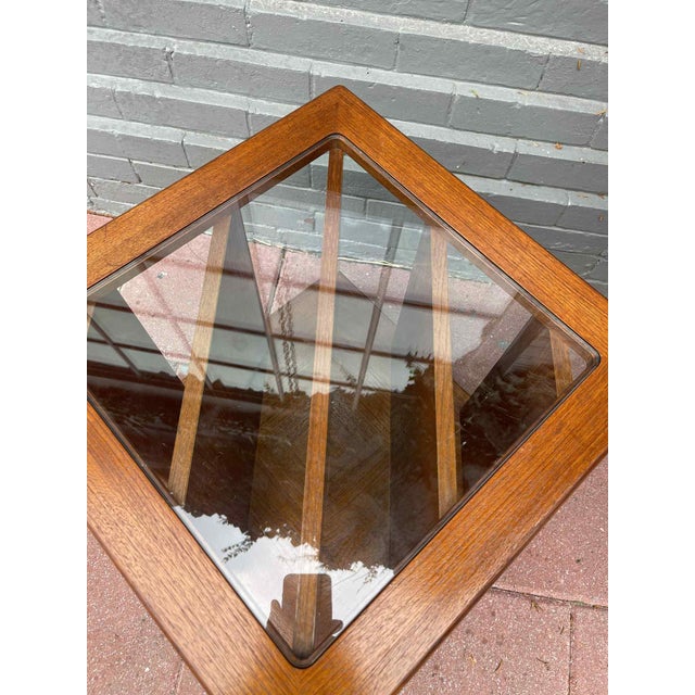 Add a touch of timeless design and practical functionality to your space with this vintage Mid-Century Modern side table....