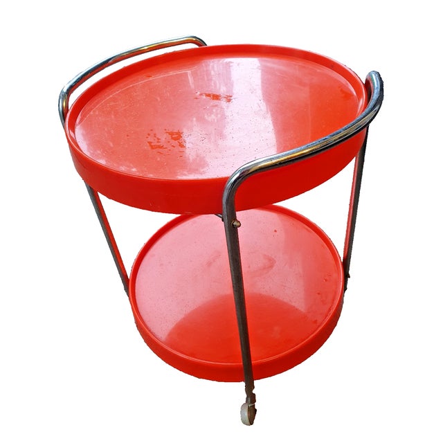 Experience the charm of the 70s with this exclusive serving table in a space-age design. The combination of gleaming...