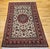 "An elegant and finely woven vintage Persian Isfahan room size rug, hand-knotted in the mid-20th century and showcasing...