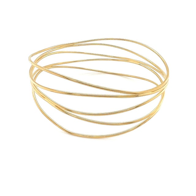 Experience the epitome of elegance with the Tiffany & Co. Peretti 18k Yellow Gold Bangle Bracelet. Designed with a classic...