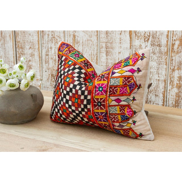 These colorful throw pillows are made from Rabari tribal dowry bags. The embroidery is on cotton and has intricate chain...