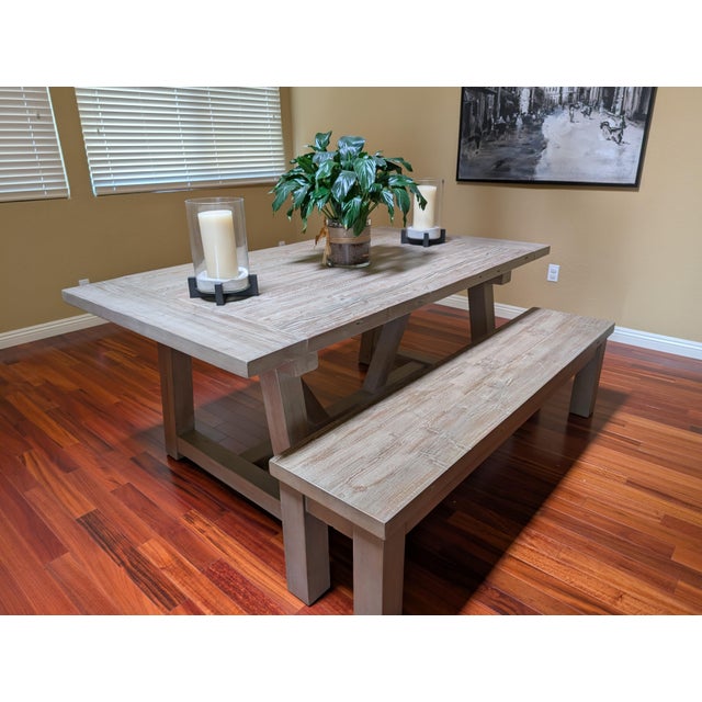 Handcrafted from salvaged solid pine timbers from 100-year-old buildings in Great Britain, the table from designer Timothy...