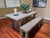 Handcrafted from salvaged solid pine timbers from 100-year-old buildings in Great Britain, the table from designer Timothy...