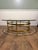 Lebarge glass octogon coffee table with brass swan head and hoof feet base. There is no label on the table. Glass has...
