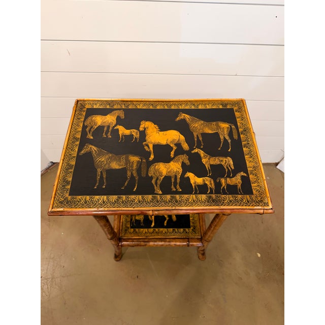 This 19th Century English Bamboo Side table features a delightful variety of elk images decoupaged onto the top and lower...